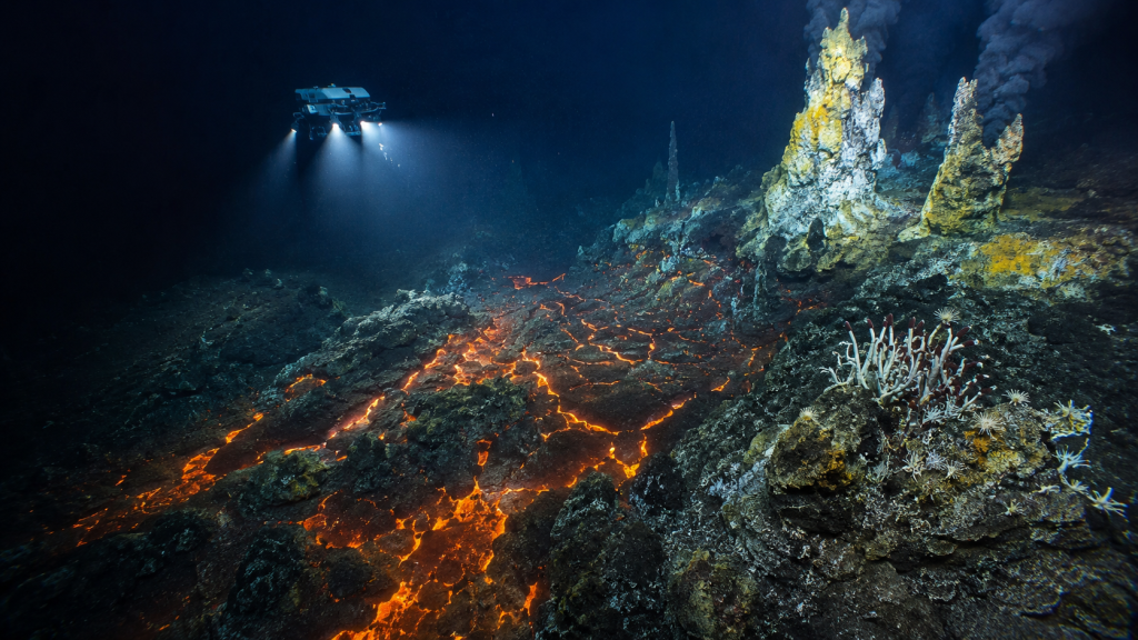Axial Seamount underwater volcano on the Pacific Ocean seafloor with hydrothermal vents glowing in the deep